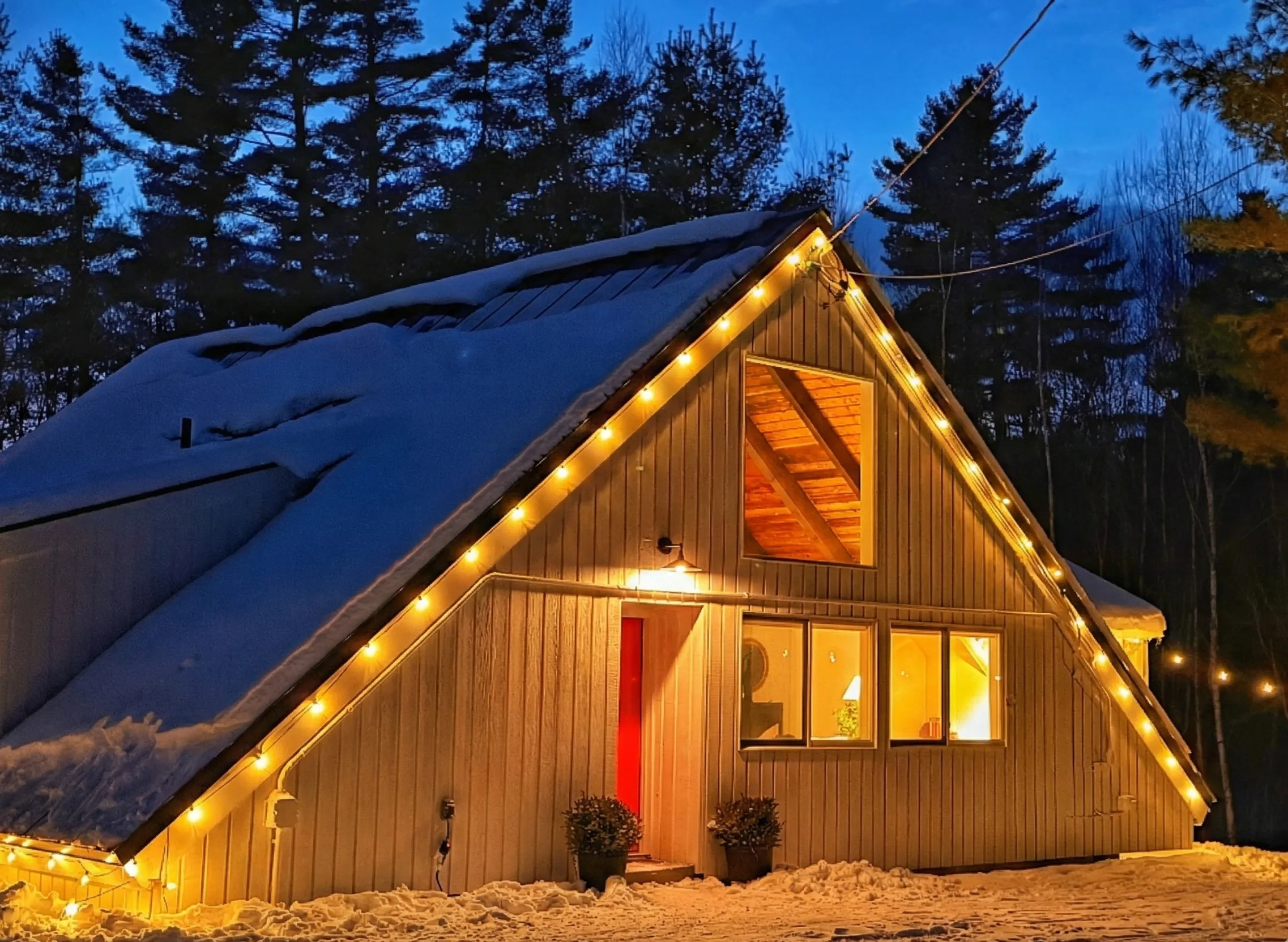 White Birch A-frame illuminated at dusk